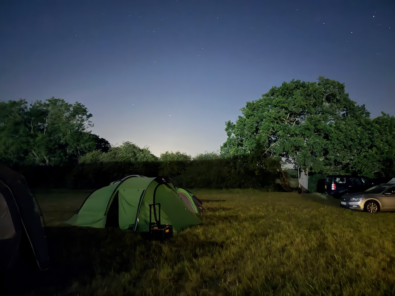 A Scout tent beneath a starry sky