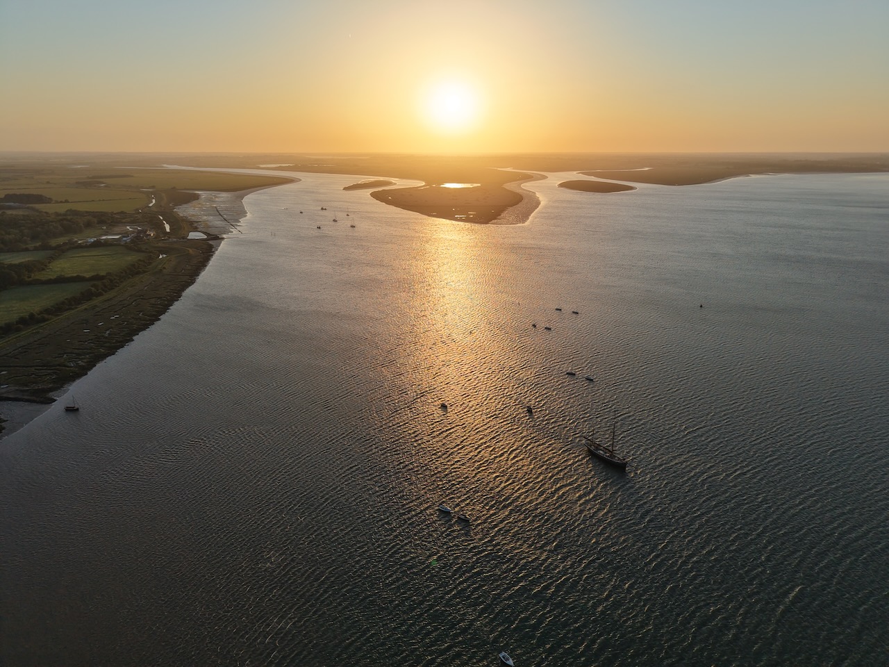 Scouts sailing at sunset